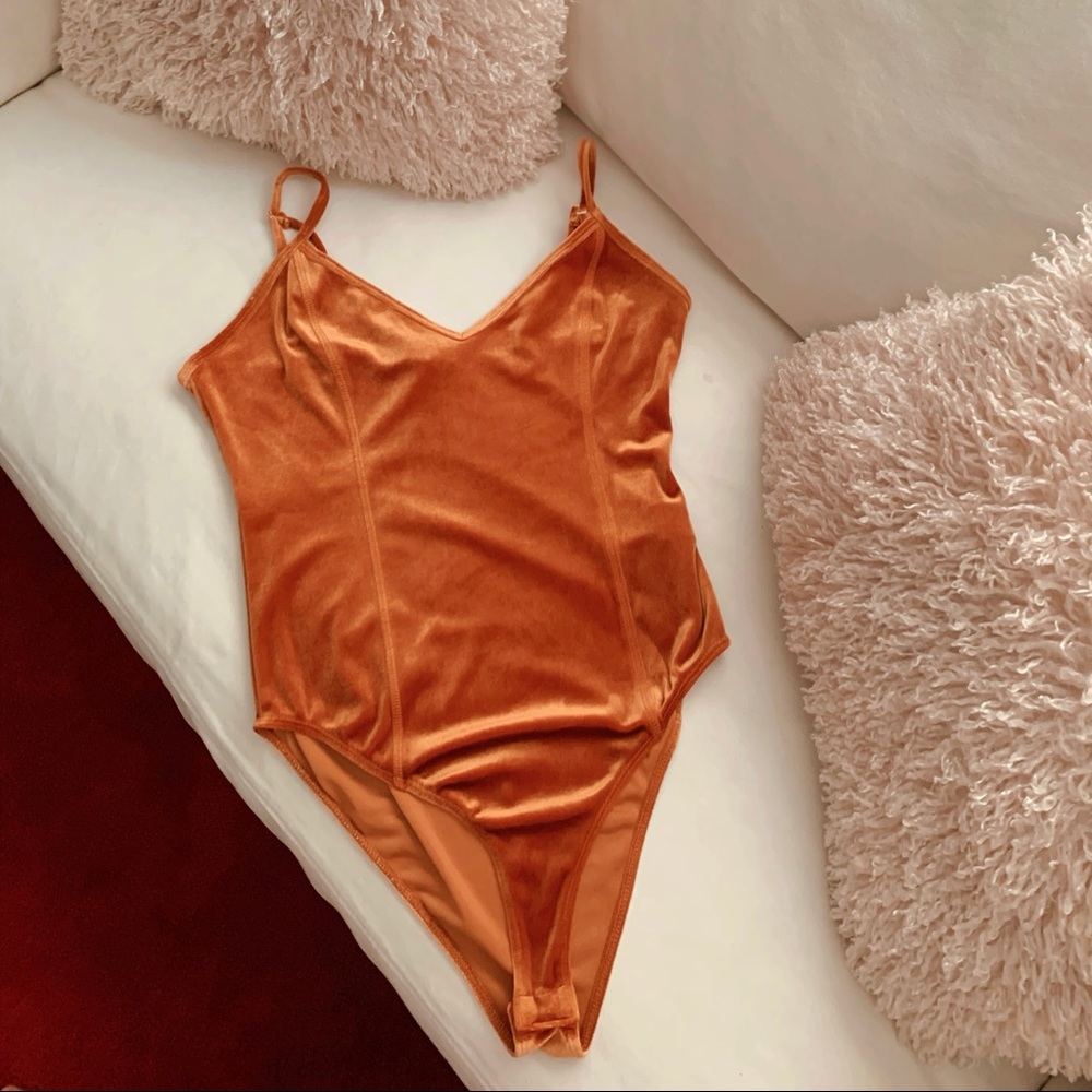 Orange velvet body suit